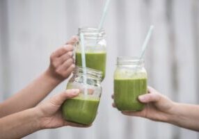 A closeup shot of tasty green vegan fresh smoothie